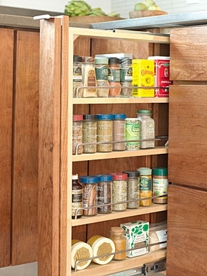 Perfectly organized and hidden spice rack with custom kitchen cabinets in Northern Virginia home
